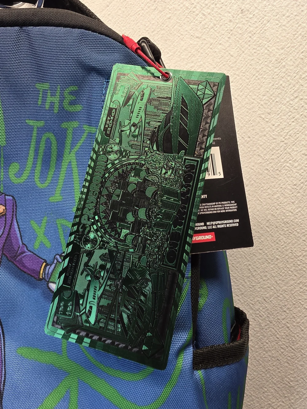 Sprayground DC Joker No Rules Backpack featuring a vibrant, graffiti-styled Bag